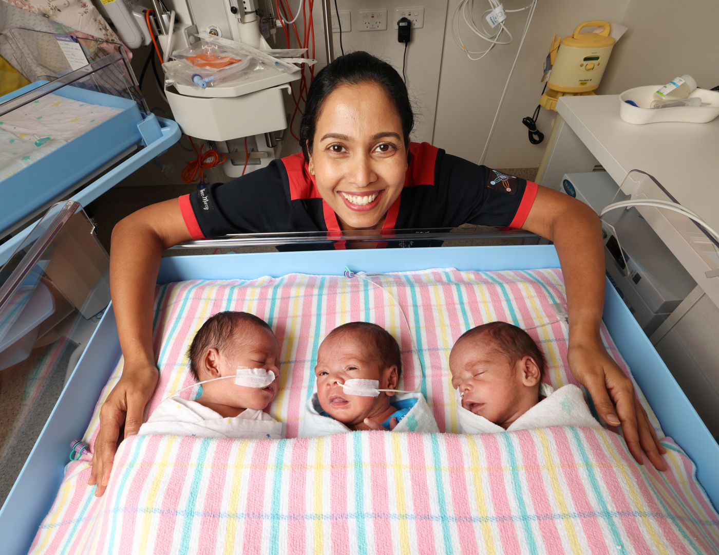 Triplets Joseph, Simon and Pita Cokiverata with Springfield’s Neonatal Critical Care Nurse Unit Manager Liji Pullookaran.